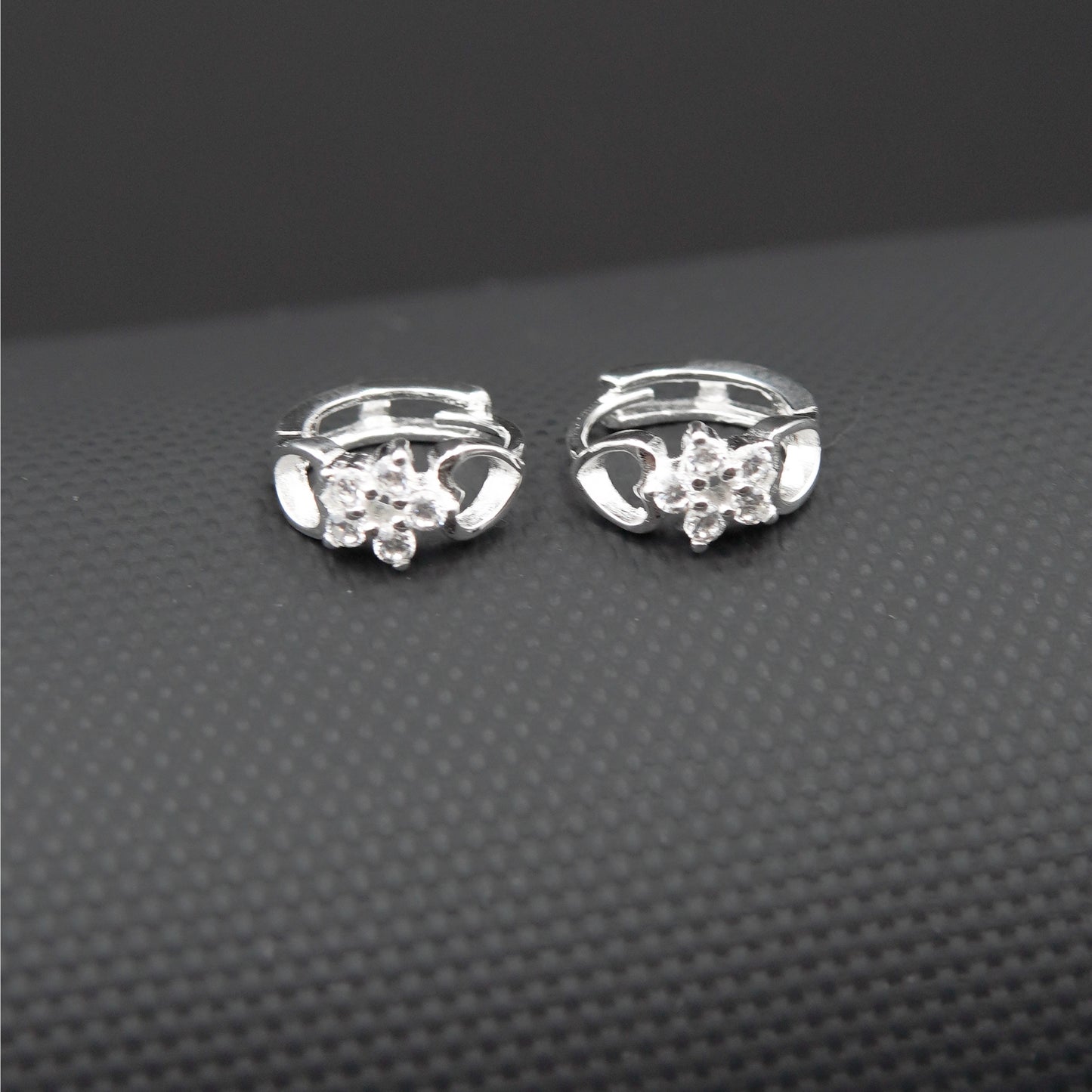 Hugguies flor plata .925